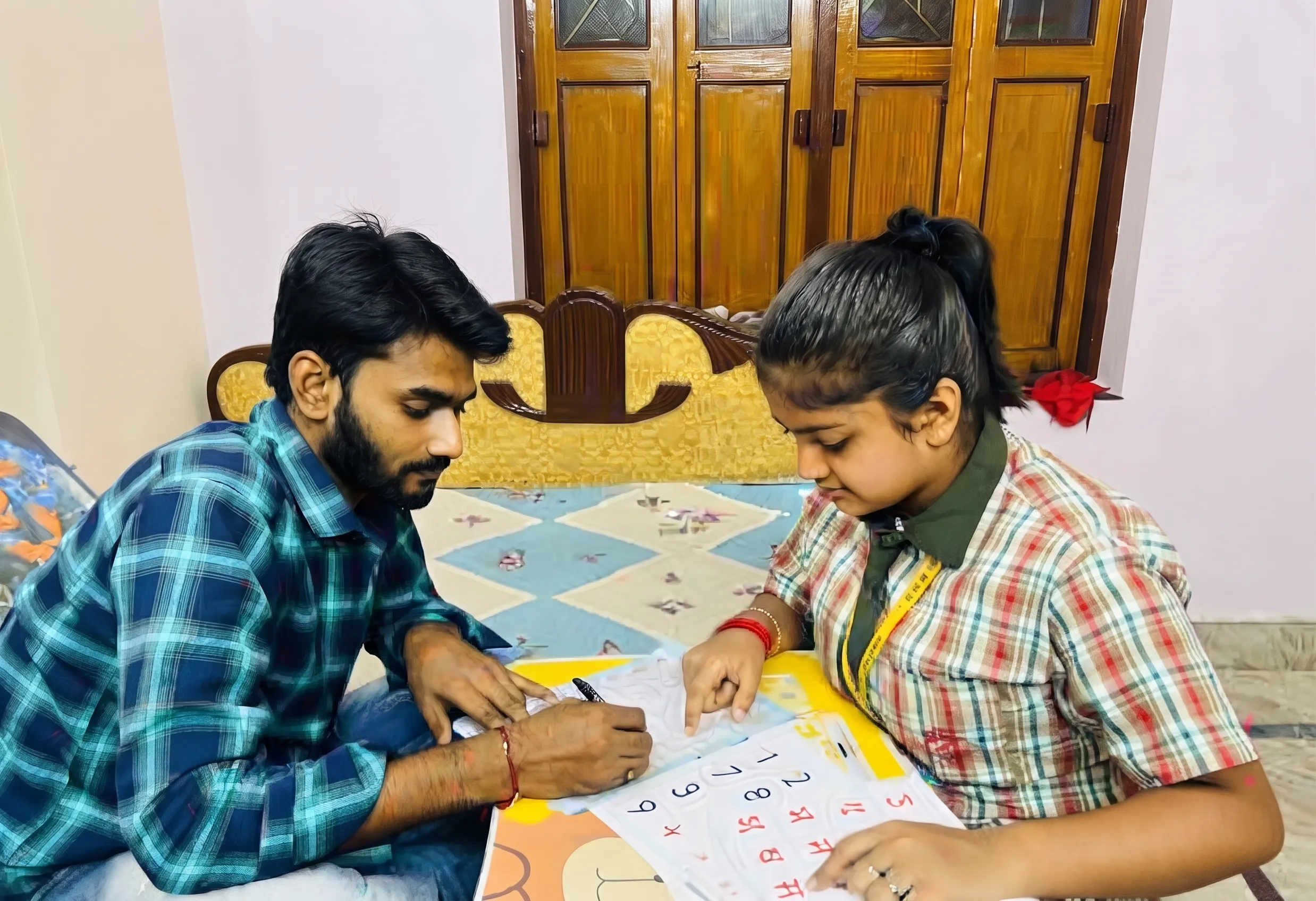 a DIKSHA student teaching at home